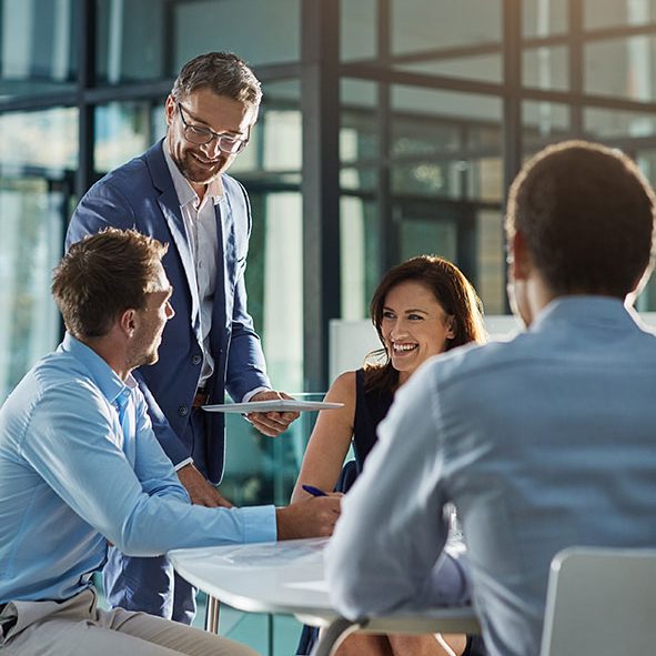 Workers collaborating in office